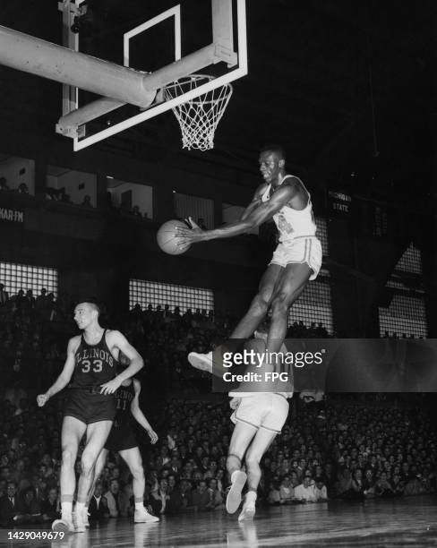 American basketball player Johnny Green, of Michigan State Spartans, in action against Illinois Fighting Illini players, at Jenison Fieldhouse in...