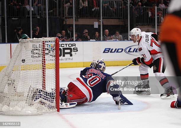 Nick Foligno of the Ottawa Senators scores the game tying goal at 15:23 of the third period against Henrik Lundqvist of the New York Rangers in Game...