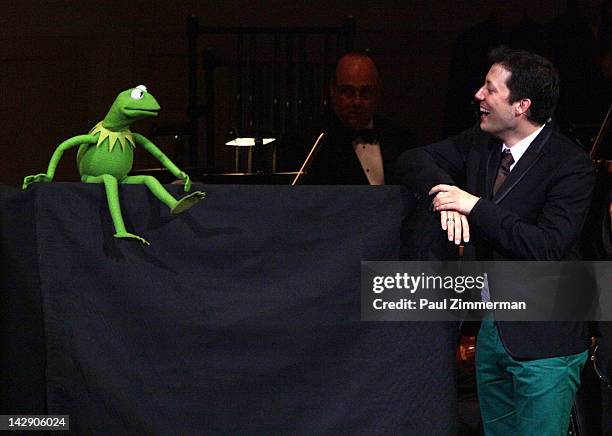 Kermit the Frog and host John Tartaglia perform during the The New York Pops Present "Jim Henson's Musical World" at Carnegie Hall on April 14, 2012...