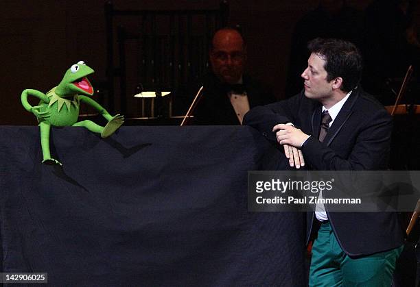 Kermit the Frog and host John Tartaglia perform during the The New York Pops Present "Jim Henson's Musical World" at Carnegie Hall on April 14, 2012...