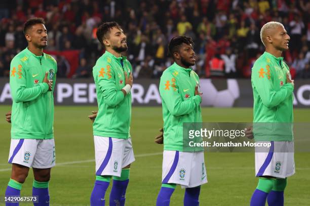 Danilo, Alex Telles, Fred and Richarlison of Brazil sing the National Anthem prior to kick off in the Friendly International match between Brasil and...
