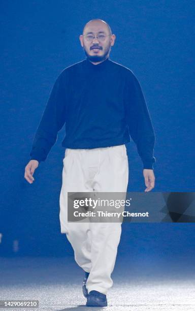 Japanese fashion designer Satoshi Kondo greets the audience at the end of the Issey Miyake Womenswear Spring/Summer 2023 show as part of Paris...