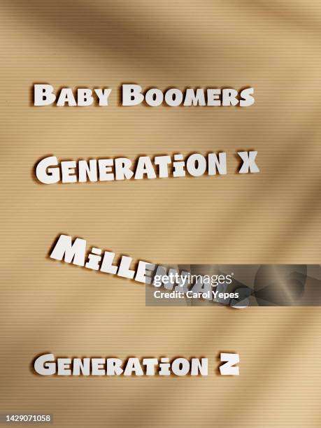 boomers, generation x, millenials message in paper work - baby boomer and millennial stock pictures, royalty-free photos & images