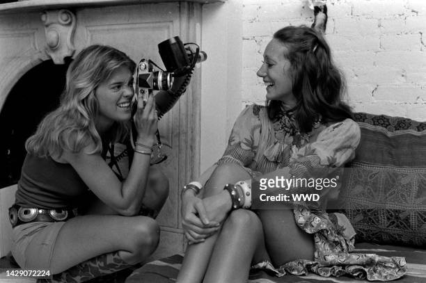 Photographer Berry Berenson takes pictures of model Marisa Berenson during an interview in the photographer's live-in photo studio apartment on...