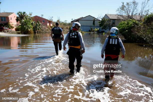 Members of the Texas A&M Task Force 1 Search and Rescue team look for anyone needing help after Hurricane Ian passed through the area on September...