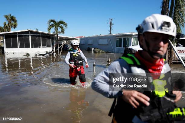 Members of the Texas A&M Task Force 1 Search and Rescue team look for anyone needing help after Hurricane Ian passed through the area on September...