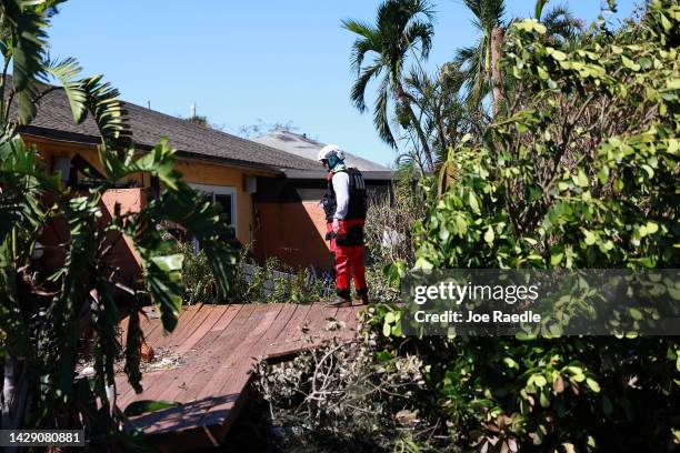 Member of the Texas A&M Task Force 1 Search and Rescue team looks for anyone needing help after Hurricane Ian passed through the area on September...