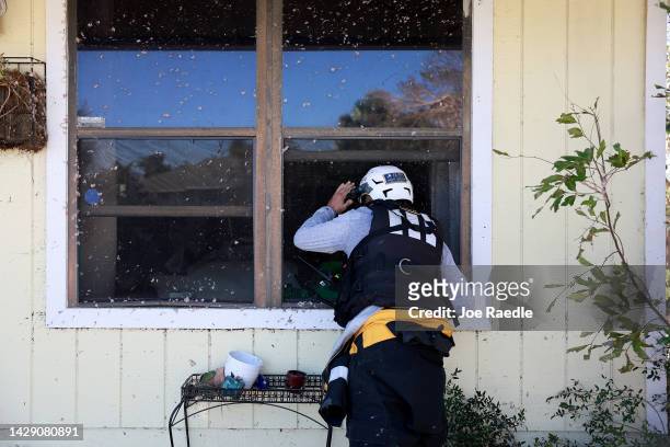 Member of the Texas A&M Task Force 1 Search and Rescue team looks for anyone needing help after Hurricane Ian passed through the area on September...