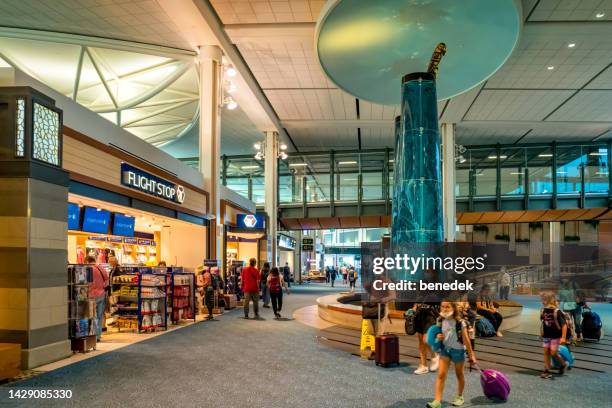 vancouver international airport terminal travelers canada - vancouver international airport stock pictures, royalty-free photos & images