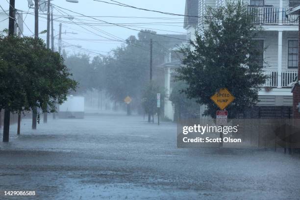 Rain from Hurricane Ian floods a street on September 30, 2022 in Charleston, South Carolina. Ian hit Florida as a category 4 storm before crossing...