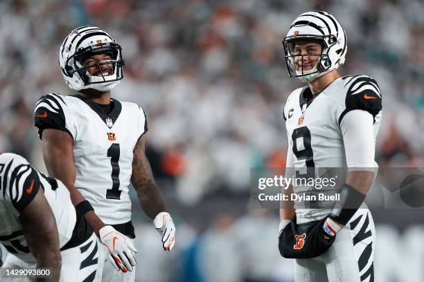 Ja'Marr Chase and Joe Burrow of the Cincinnati Bengals meet in the fourth quarter against the Miami Dolphins at Paycor Stadium on September 29, 2022...