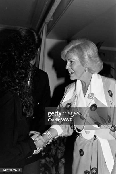 Rhonda Rivera greets Jane Morgan during a party at the Beverly Hills, California, home of producer Jerry Weintraub on February 22, 1983.