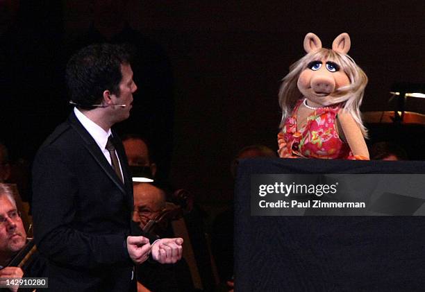 Host John Tartaglia and Miss Piggy perform during the The New York Pops Present "Jim Henson's Musical World" at Carnegie Hall on April 14, 2012 in...