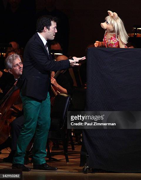 Host John Tartaglia and Miss Piggy perform during the The New York Pops Present "Jim Henson's Musical World" at Carnegie Hall on April 14, 2012 in...