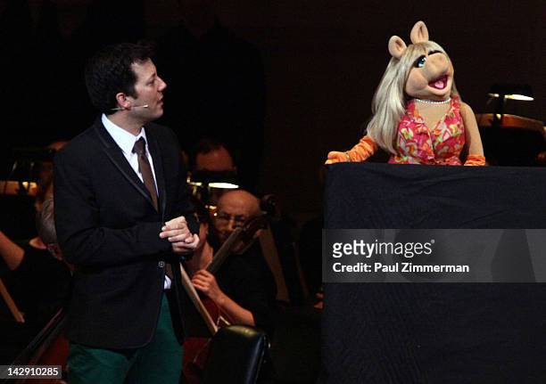 Host John Tartaglia and Miss Piggy perform during The New York Pops Present "Jim Henson's Musical World" at Carnegie Hall on April 14, 2012 in New...