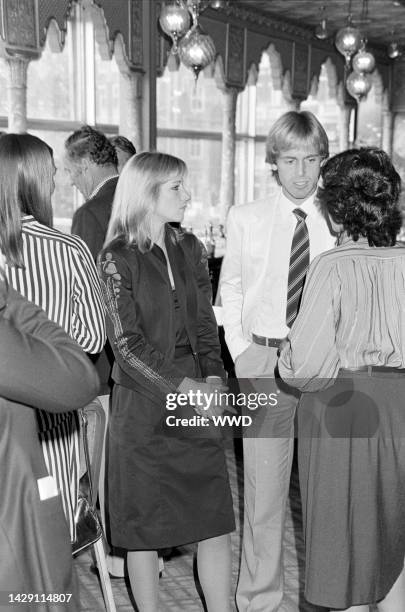 Tennis players Chris Evert, John Lloyd and guests attend the Wimbledon luncheon in London, England, on June 22, 1982.