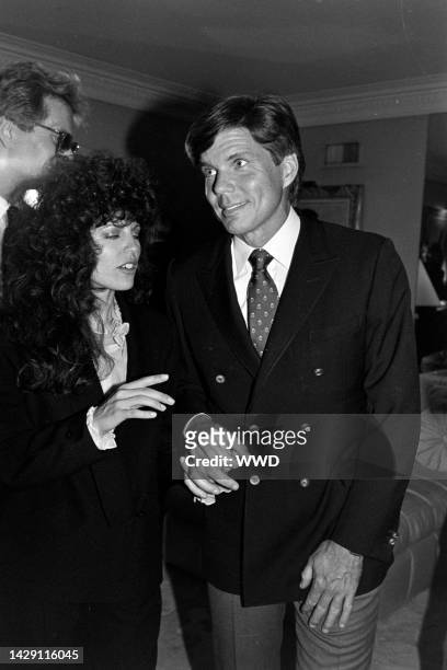 Rhonda Rivera and John Davidson attend a party at the Beverly Hills, California, home of producer Jerry Weintraub on February 22, 1983.