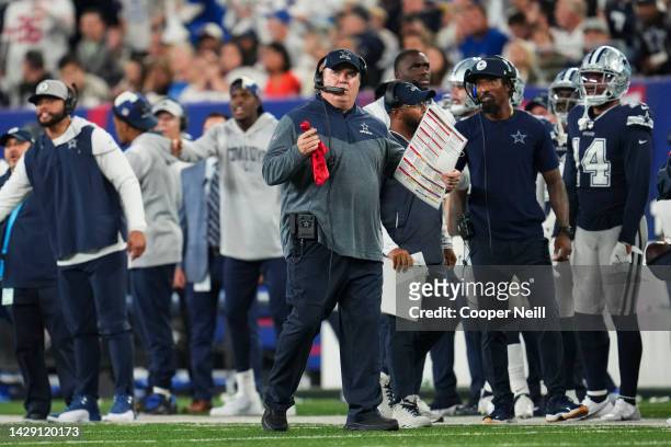 Head coach Mike McCarthy of the Dallas Cowboys holds a red challenge flag against the New York Giants at MetLife Stadium on September 26, 2022 in...