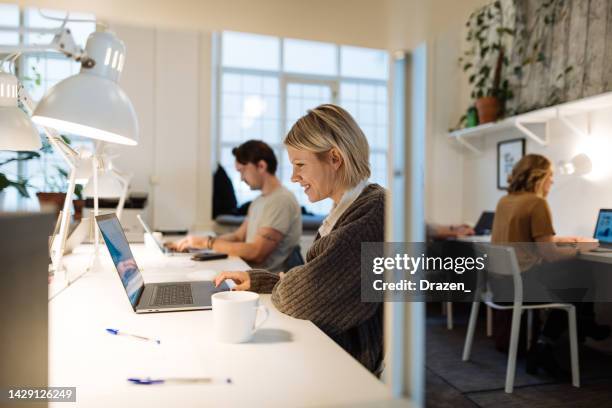 business and coworking with multi-ethnic professionals - business finance and industry stock pictures, royalty-free photos & images