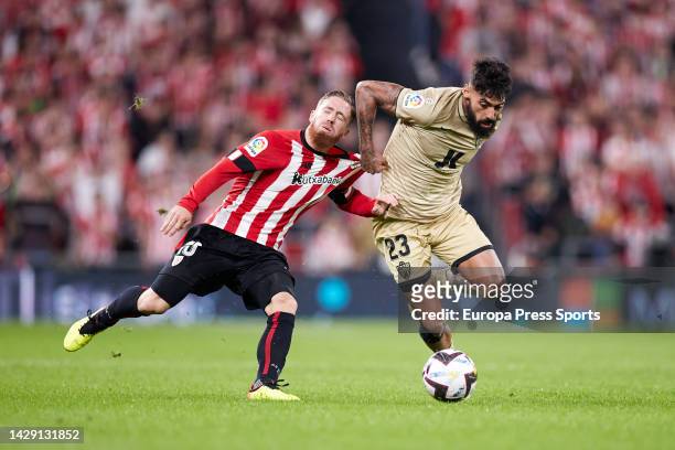 Iker Muniain of Athletic Club competes for the ball with Same Costa of UD Almeria during the La Liga Santander football match between Athletic Club...