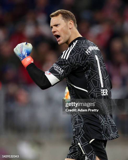 Manuel Neuer of Bayern Munich celebrates their side's win after the final whistle of the Bundesliga match between FC Bayern München and Bayer 04...