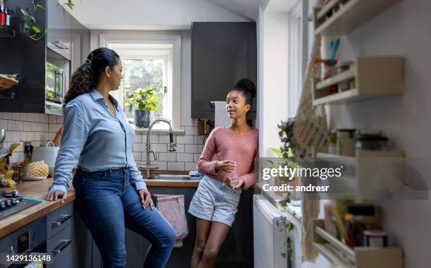 happy mother and daughter bonding at home - teens talking stock pictures, royalty-free photos & images