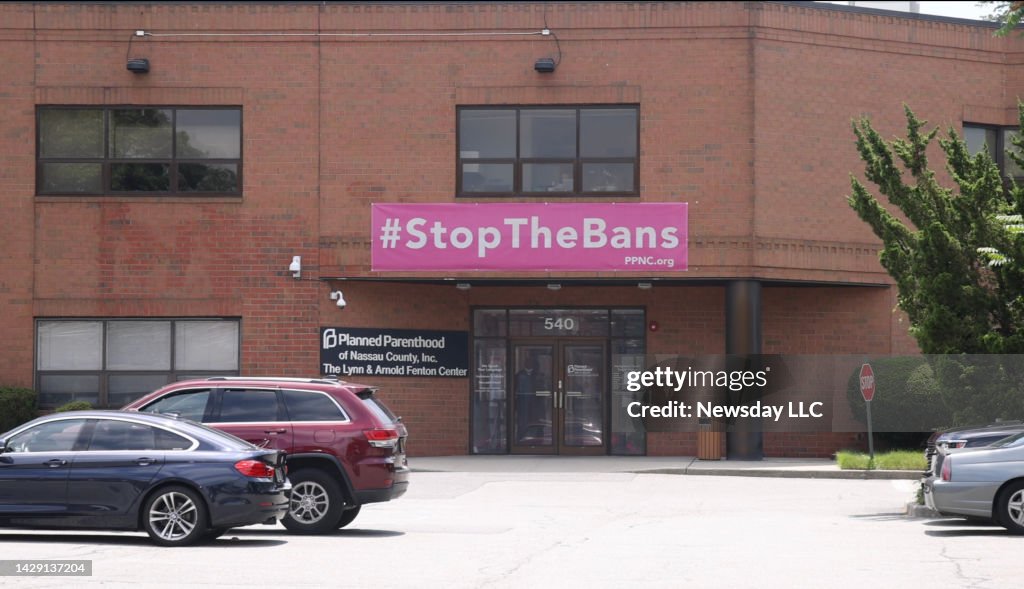 Planned Parenthood of Nassau County, Inc. building with #Stop the Bans pink banner