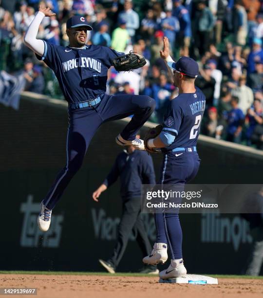 Christopher Morel and Nico Hoerner of the Chicago Cubs celebrate their team win over the Cincinnati Reds at Wrigley Field on September 30, 2022 in...