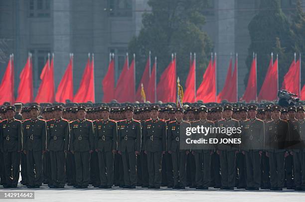 North Korean soldiers stand in formation during a military parade in honour of the 100th birthday of the late North Korean leader Kim Il-Sung in...