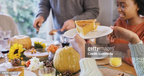 family, food and celebration with christmas pie or thanksgiving pumpkin dessert to celebrate holiday. home cooking, diversity and men and women eating at happy lunch table for festive dinner party. - man eating pie stock pictures, royalty-free photos & images