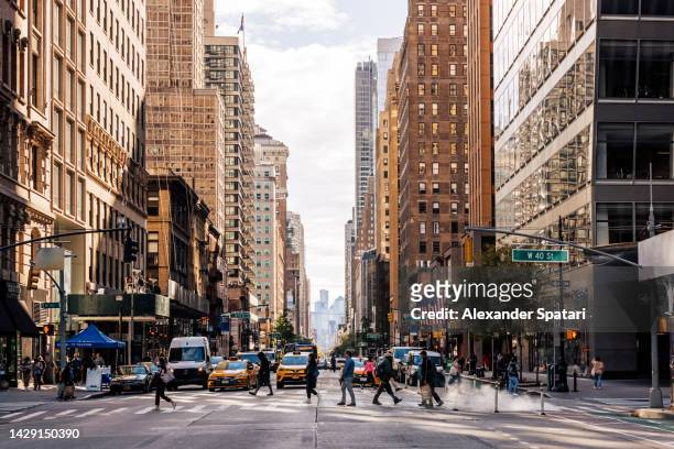 6th avenue going through midtown manhattan, new york city, usa - big apple stock pictures, royalty-free photos & images