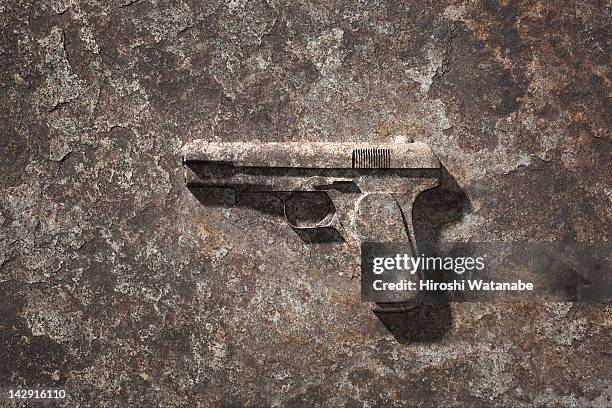 handgun which became stone - handgun - fotografias e filmes do acervo