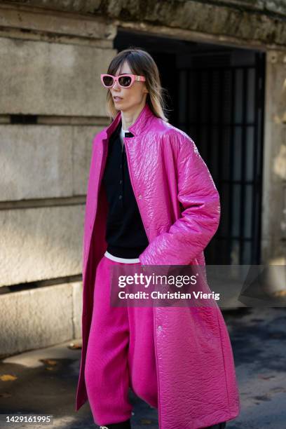 Anya Ziourova wears pink coat, pants, Chanel boots outside Rick Owens during Paris Fashion Week - Womenswear Spring/Summer 2023 : Day Four on...