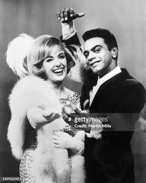 American comedienne, actress, singer and businesswoman, Edie Adams and American singer, Johnny Mathis, dance and smile on The Edie Adams Show in Los...