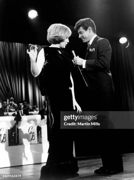 American comedienne, actress, singer and businesswoman, Edie Adams , talks with, American singer and actor Eddie Fisher on the Here's Edie! The First...