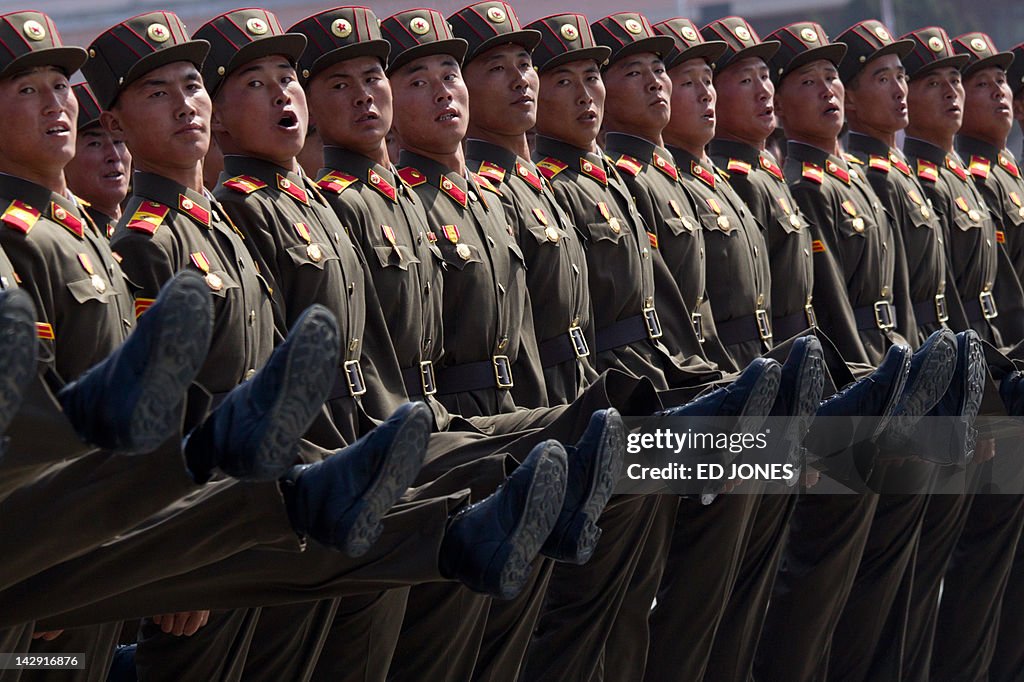 North Korean soldiers march during a mil