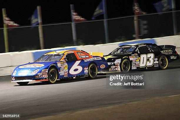 Derek Thorn, driver of the Sunrise Ford, leads Dylan Kwasniewski, driver of the Rockstar/Royal Purple Ford, during the NASCAR K&N Pro Series West...