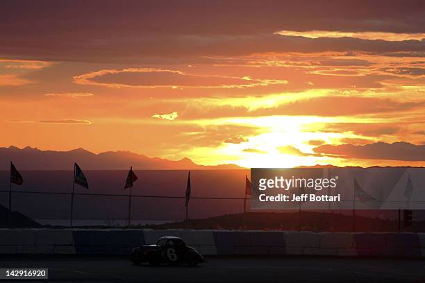 Late model cars race prior to the start of the NASCAR K&N Pro Series West Toyota/NAPA Auto Parts 150 at Havasu 95 Speedway on April 14, 2012 in Lake...
