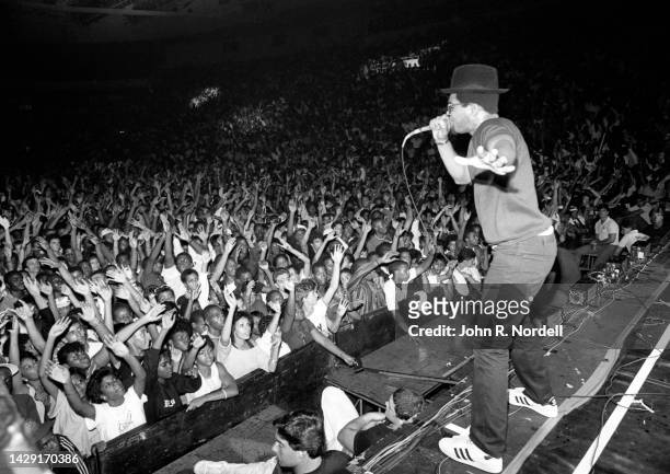 American rapper Darryl "DMC" McDaniels, of the American hip hop group Run-D.M.C, sings on stage during the 1985 Fresh Fest at the Providence Civic...