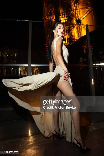 Ann Lu attends The Loubi Show II At Eiffel Tower During Paris Fashion Week, on September 30, 2022 in Paris, France.