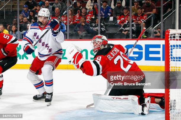 Filip Chytil of the New York Rangers keeps his eyes on the puck during the first period against Mackenzie Blackwood of the New Jersey Devils at the...