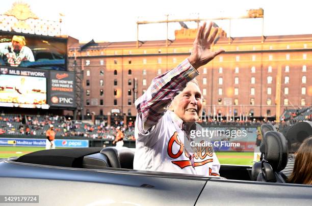 Former Baltimore Orioles and Hall of Famer Brooks Robinson waves to the crowd before the game between the Baltimore Orioles and the Houston Astros at...