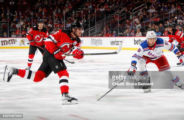 Jack Hughes of the New Jersey Devils scores at 2:21 of the first period against the New York Rangers at the Prudential Center on September 30, 2022...