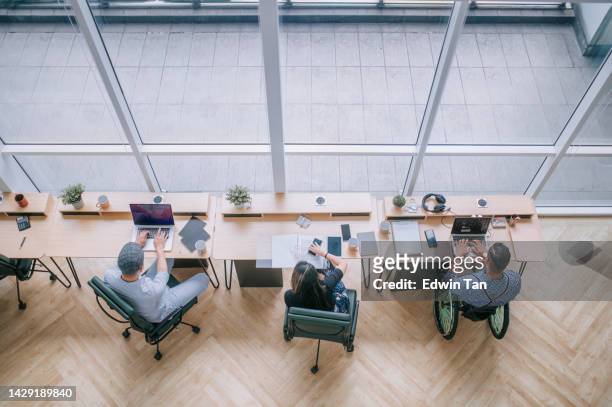 diversify asian multi-ethic white collar worker busy working in office workstation in open plan - healthcare and medicine from above stock pictures, royalty-free photos & images