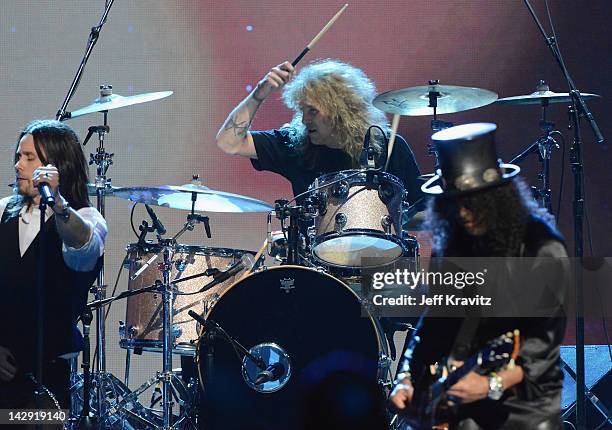 Myles Kennedy performs with inductees Steven Adler and Slash of Guns N' Roses on stage at the 27th Annual Rock And Roll Hall Of Fame Induction...