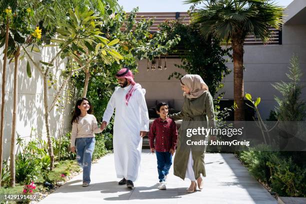 candid portrait of young riyadh family with two children - saudi home stock pictures, royalty-free photos & images
