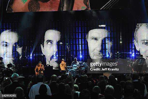 Inductees Red Hot Chili Peppers perform on stage at the 27th Annual Rock And Roll Hall Of Fame Induction Ceremony at Public Hall on April 14, 2012 in...