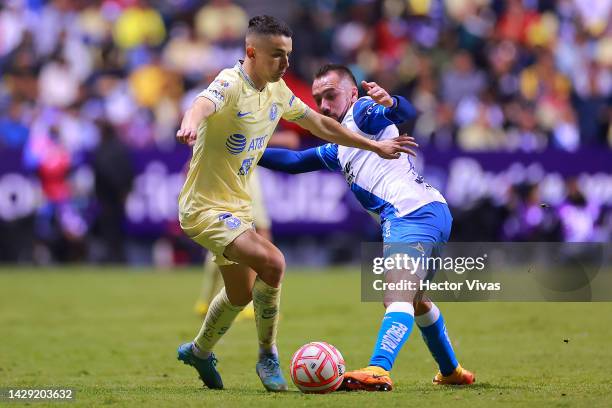 Alvaro Fidalgo of America battles for possession with Federico Mancuello of Puebla during the 17th round match between Puebla and America as part of...