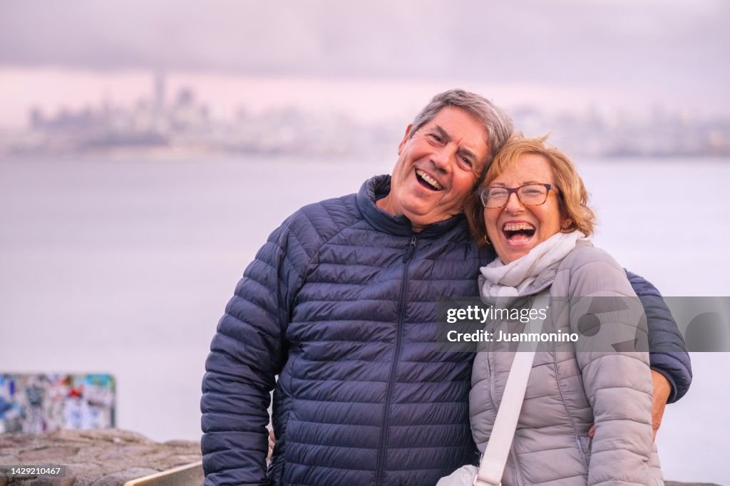 Smiling senior couple looking at the camera