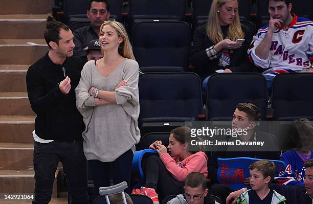 Jude Law, guest, Iris Law, Finlay Law and Rudy Law attend the Ottawa Senators vs New York Rangers game at Madison Square Garden on April 14, 2012 in...